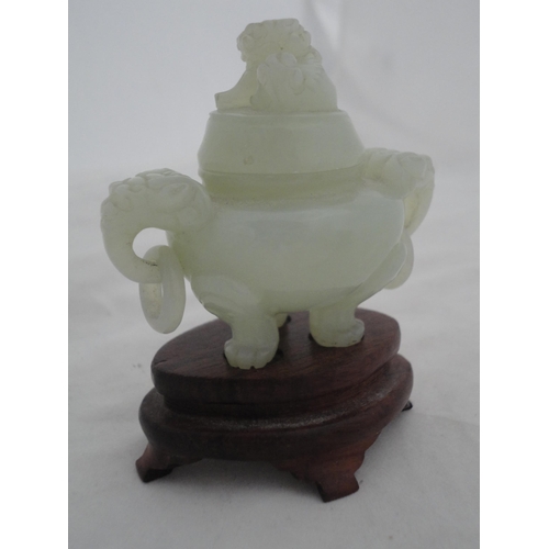 204 - Small Chinese-style jade-coloured censer and cover on stand, and a similar jade-coloured temple dog.... 
