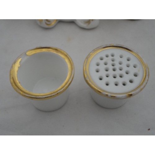 205 - Continental ceramic desk stand with winged putti surmount and integral inkwells, decorated with encr... 