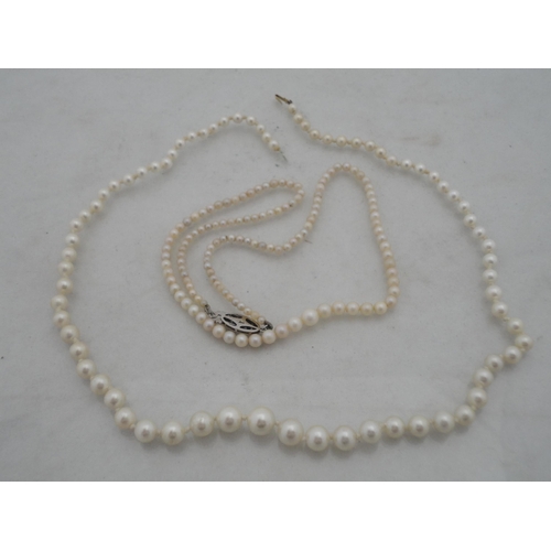 209 - String of synthetic pearls with 9ct gold clasp and a similar necklace.&nbsp; (2)