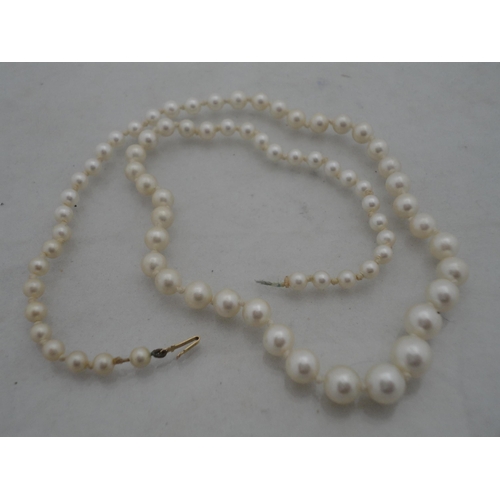 209 - String of synthetic pearls with 9ct gold clasp and a similar necklace.&nbsp; (2)