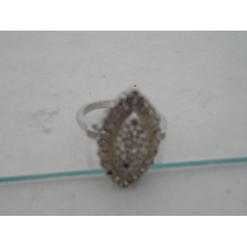 210 - Silver bangle and a child's silver bangle, 30g gross, also a marquis-shaped cocktail ring on silver ... 