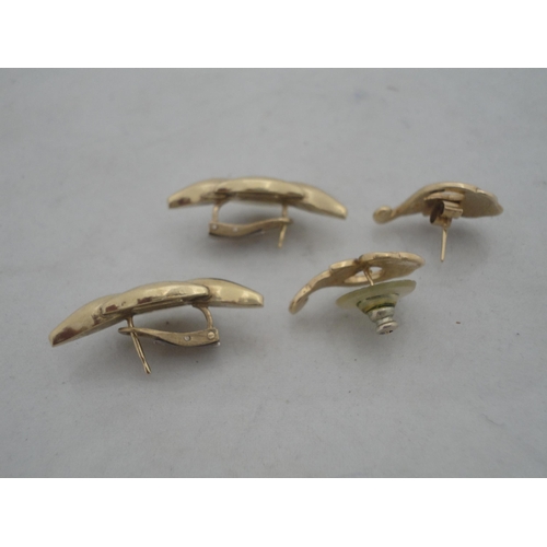 212 - Pair of 9ct gold earrings, 7g gross, and a pair of yellow metal earrings.