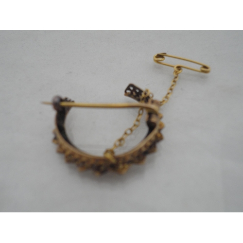 221 - 15ct gold and seed pearl-mounted crescent brooch, 3g gross.