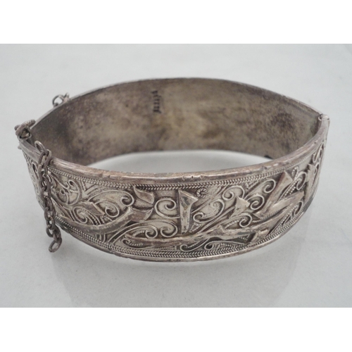 222 - Silver engine-turned vesta holder, 39g, white metal bangle and a cased silver-mounted cheroot holder... 