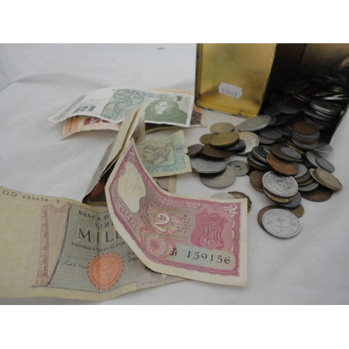 231 - Collection of world banknotes and coinage, contained in a tin.
