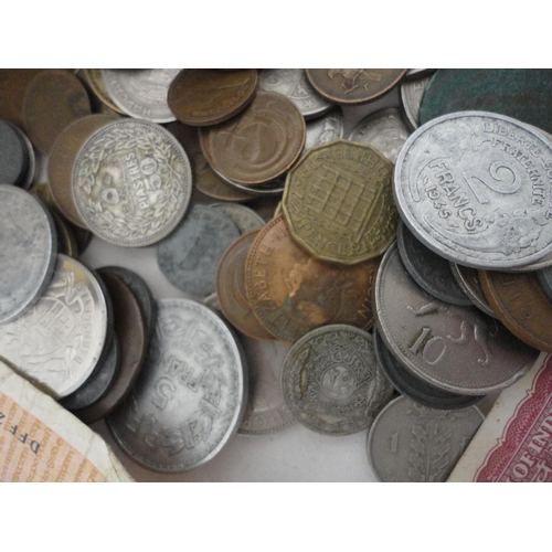 231 - Collection of world banknotes and coinage, contained in a tin.