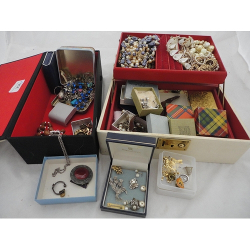 234 - Two jewellery boxes containing a large collection of costume jewellery and watches.