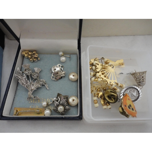 234 - Two jewellery boxes containing a large collection of costume jewellery and watches.