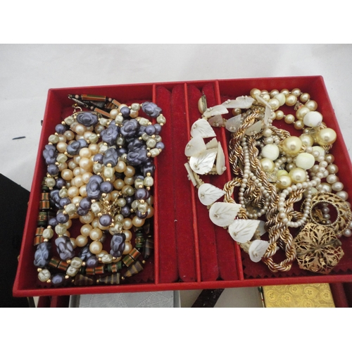 234 - Two jewellery boxes containing a large collection of costume jewellery and watches.