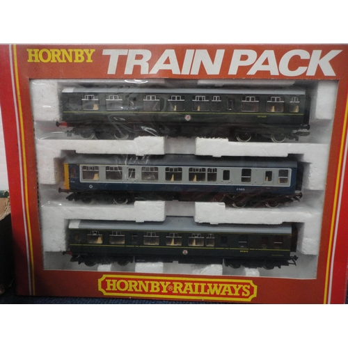 26 - Carton containing 00 gauge coaches and rolling stock to include a boxed Hornby R.267 two car DMU cla... 