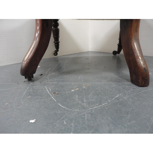 283 - Victorian mahogany framed open armchair on brass castors.