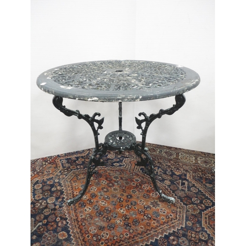 290 - Reproduction Coalbrookdale-style garden table, painted in green, three similar chairs and a parasol ... 