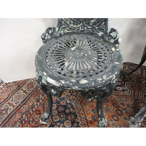 290 - Reproduction Coalbrookdale-style garden table, painted in green, three similar chairs and a parasol ... 