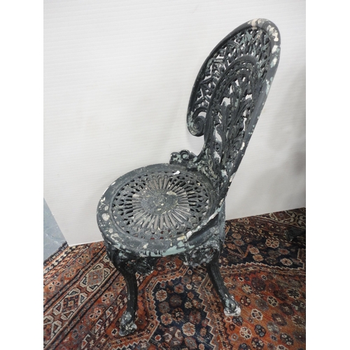 290 - Reproduction Coalbrookdale-style garden table, painted in green, three similar chairs and a parasol ... 