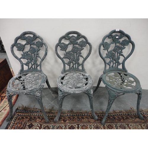 291 - Three matching reproduction Coalbrookdale-style garden chairs, painted in green.  (3)