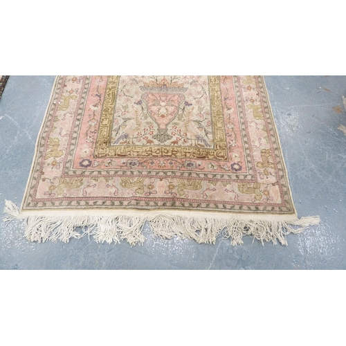 292 - Indian Kashmir hand-knotted rug decorated with animals on a pink ground.