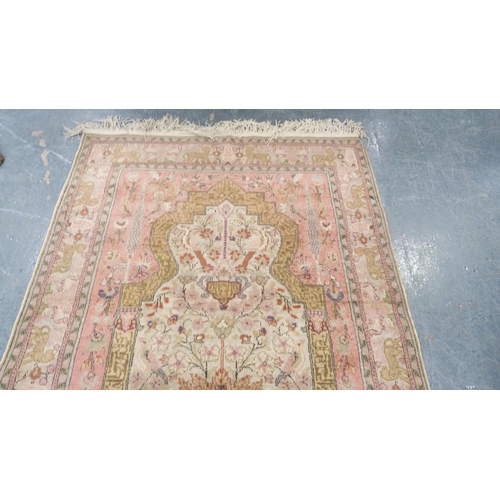 292 - Indian Kashmir hand-knotted rug decorated with animals on a pink ground.