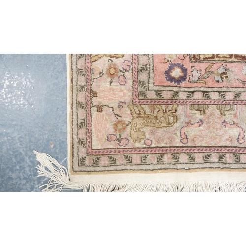 292 - Indian Kashmir hand-knotted rug decorated with animals on a pink ground.