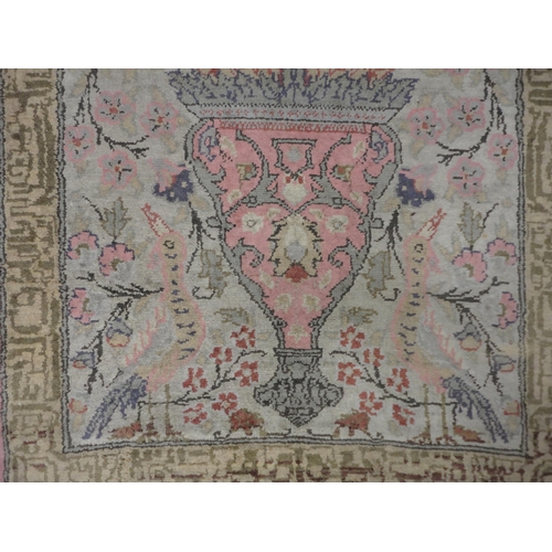 292 - Indian Kashmir hand-knotted rug decorated with animals on a pink ground.