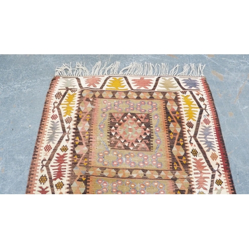 294 - Turkish nomadic multi-coloured rug with all over geometric decoration.