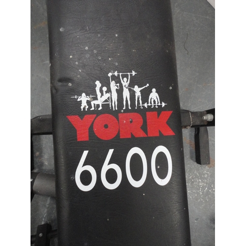 296 - York 6600 bench press with various weights.