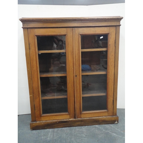 307 - 19th century two-door bookcase with glazed doors enclosing shelves.