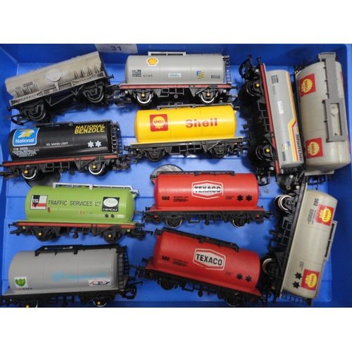 31 - Two cartons containing 00 gauge tankers and rolling stock, Pullman coaches etc.