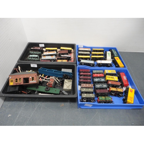 33 - Four small cartons containing 00 gauge rolling stock, tankers, accessories etc.