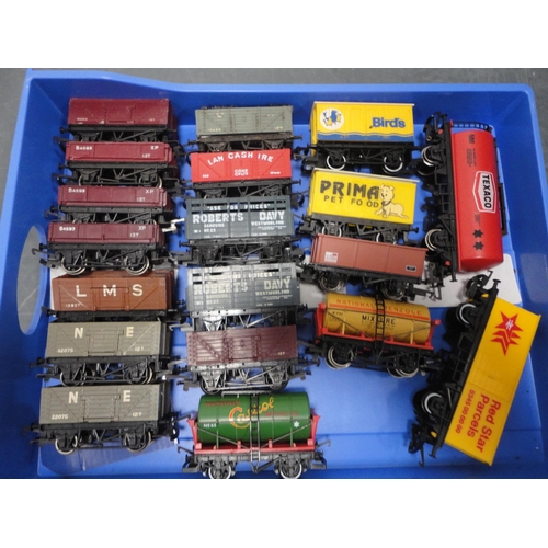 33 - Four small cartons containing 00 gauge rolling stock, tankers, accessories etc.