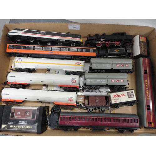 34 - Three cartons containing 00 gauge tankers, coaches, 47606 locomotive, rolling stock, parts etc.