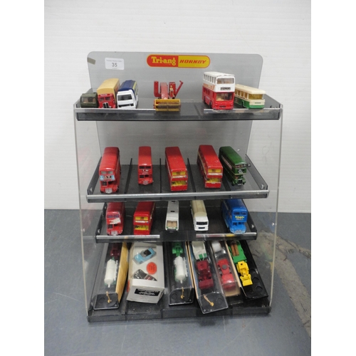 35 - Carton containing assorted diecast models to include Dinky examples, double decker buses, vans etc.,... 