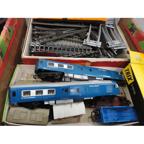 40 - Three cartons containing 00 gauge locomotive parts, coach parts, track etc.