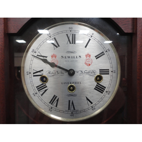 53 - Modern wall clock by Sewells of Liverpool with triple train dial.