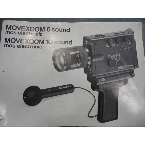 67 - Movexoom hand-held camera with accessories, cased, and assorted movie still photographs and ephemera... 