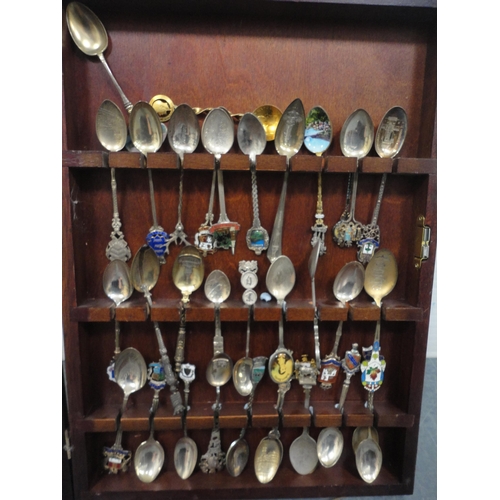 68 - Collection of souvenir spoons to include some silver examples, contained in a display case.