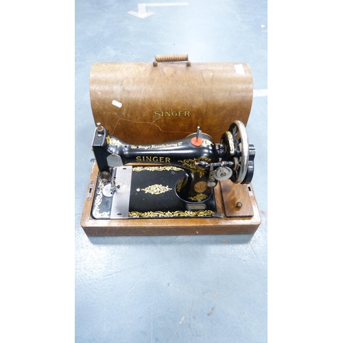 72 - Singer portable sewing machine in fitted case.