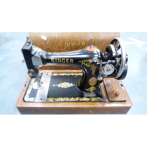 72 - Singer portable sewing machine in fitted case.