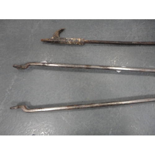 73 - Set of polished steel fire tongs, another set of tongs, poker and a set of brass-coated bellows.