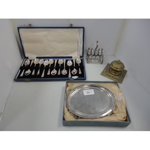 84 - EP oval card tray, toast rack, cased set of twelve EP teaspoons and a brass inkwell.