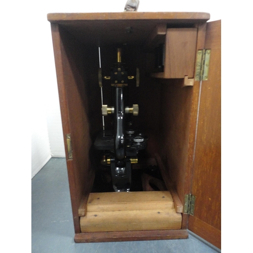 92 - Microscope in fitted box and boxes of various slides.