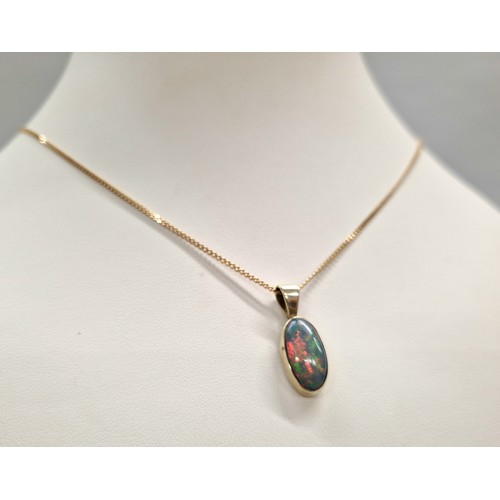 231 - Opal doublet mounted in a yellow metal pendant on 9ct gold chain, gross weight 4.7g