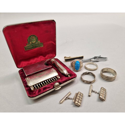 244 - Four silver rings, two tie clips, pair silver cufflinks, and an Ever Ready compact razor