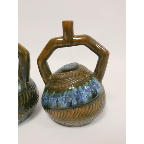 180 - Christopher Dresser (1834-1904). Pair of Linthorpe art pottery twin-handled Peruvian vessels, c1880,... 