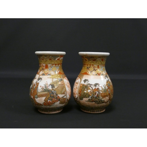 263 - Pair of Japanese Satsuma bud vases with panels depicting Geisha's within garden scenes surmounted by... 