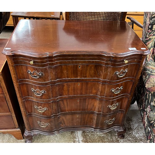 616 - Serpentine fronted mahogany four-drawer chest with brush slide, raised on cabriole legs