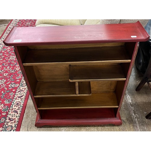 621 - Oriental style hardwood open bookcase with carved foliage design in relief, 81cm high