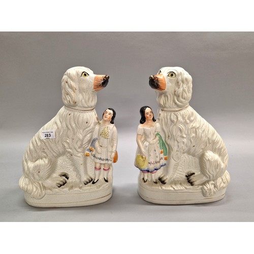 283 - Pair of Staffordshire figures of wally dogs and figures.