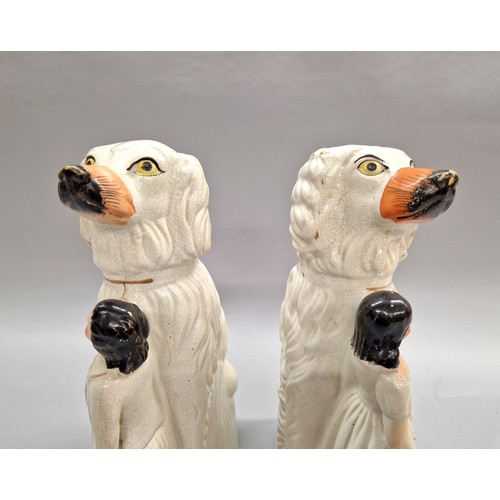 283 - Pair of Staffordshire figures of wally dogs and figures.