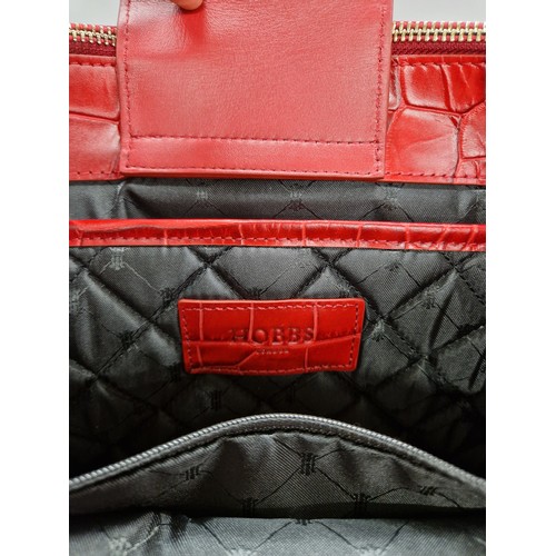 289 - Hobbs red leather large hand bag, with protective cloth bag.