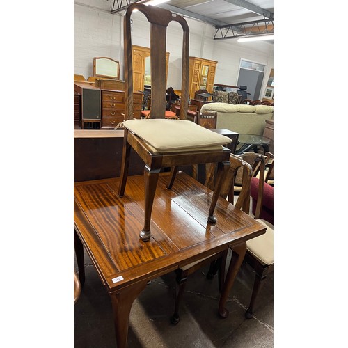 653 - Mahogany extending dining table with four matching upholstered dining chairs